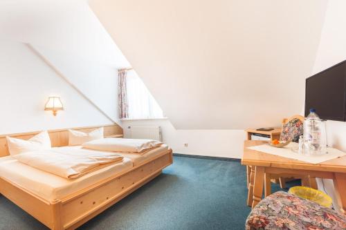 Postel nebo postele na pokoji v ubytování Hotel und Restaurant Piccolo