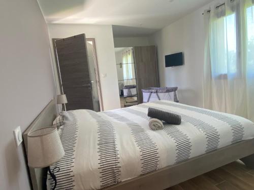 Ένα ή περισσότερα κρεβάτια σε δωμάτιο στο Terra bella Costa Verde T2 classé 3 étoiles