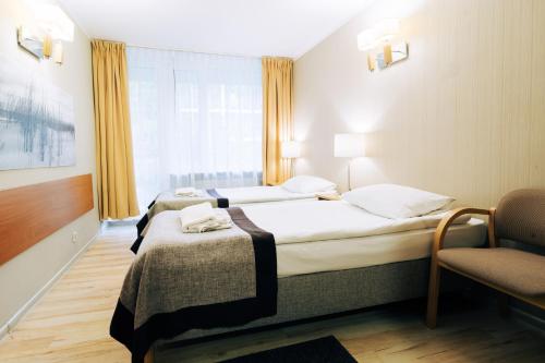 Ένα ή περισσότερα κρεβάτια σε δωμάτιο στο Hotel Orle