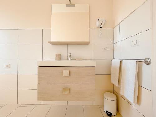 a small bathroom with a sink and a toilet at Brain Apartment Pagani in Pagani