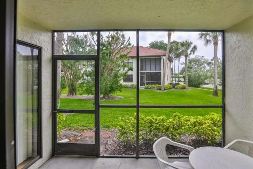 an open door to a yard with a table and chairs at Shorewalk Condominium in Bradenton