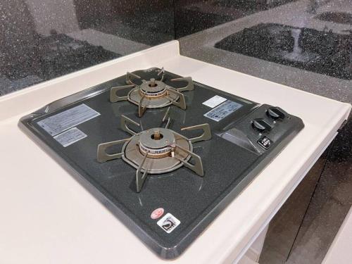 a stove top with two burners on top of it at 日本橋ルーム41-ArashiHotel in Osaka