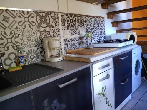 Kuchyň nebo kuchyňský kout v ubytování Le panoramique