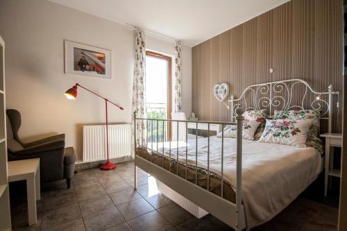 Ένα ή περισσότερα κρεβάτια σε δωμάτιο στο Apartament Motyl