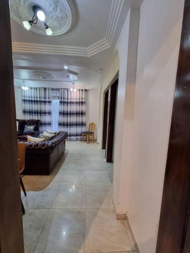 a living room with a couch and a table at Natako Apartments in Apenkwa