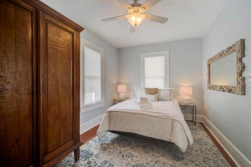 En eller flere senge i et værelse på Sunshine Bungalow