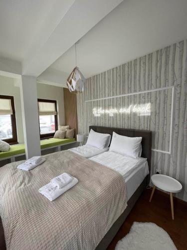 En eller flere senge i et værelse på Nivalis Residence 6