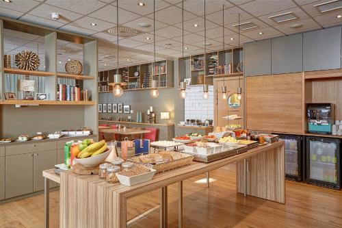 a large kitchen with a table with food on it at Akureyri - Berjaya Iceland Hotels in Akureyri