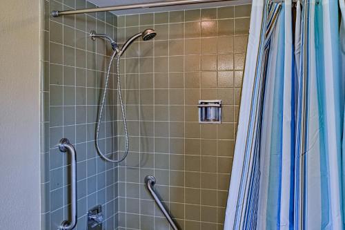 a shower with a shower head in a bathroom at Mermaid Shores in Sarasota