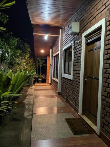 a hallway leading to a house at night at The Tenthola in Kandy