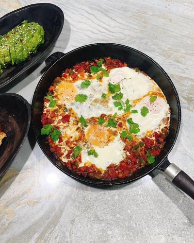 a frying pan with an egg on top of a pizza at The Kilimanjaro Villa in Moshi