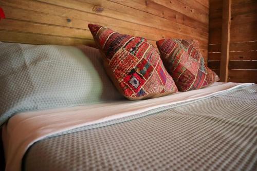 Postel nebo postele na pokoji v ubytování Jungle beach 2 bedroom cottage