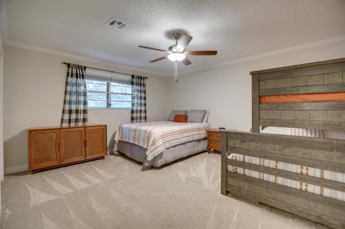 a bedroom with a bed and a ceiling fan at Houston Home near Medical Center and NRG Stadium! in Houston