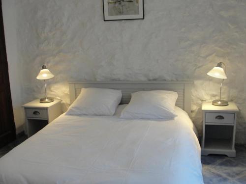 En eller flere senge i et værelse på Le Mas De La Chérine