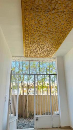 a room with a door with a gate with a window at Alam B&B in Marsa Alam City