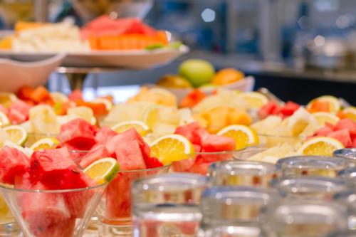 a bunch of fruit in cups on a table at Wyndham Garden Guayaquil in Guayaquil
