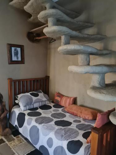 a bedroom with a bed and a cat tower at Rockscape in Sandown
