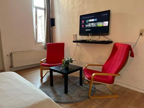 Televiisor ja/või meelelahutuskeskus majutusasutuses Laeken : Cocon Chaleureux & Confort