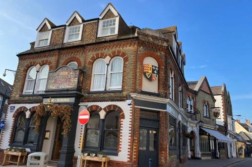 a brick building on the corner of a street at Whitstable The Jolly in Whitstable