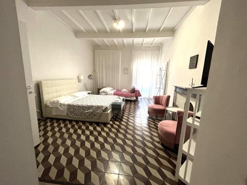 a bedroom with a bed and a living room at Allegra Toscana - Affittacamere Guest house Arezzo in Arezzo