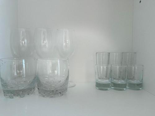 a group of empty glasses sitting on a table at Luxe Appartments on Stepnoy in Karagandy