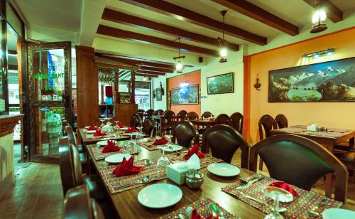 a dining room with a long table and chairs at Kathmandu Eco Hotel in Kathmandu