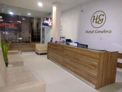 a hotel singapore lobby with a reception desk at Hotel Ginebra Sincelejo in Sincelejo