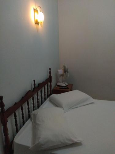 Tempat tidur dalam kamar di Pousada Samambaia SL