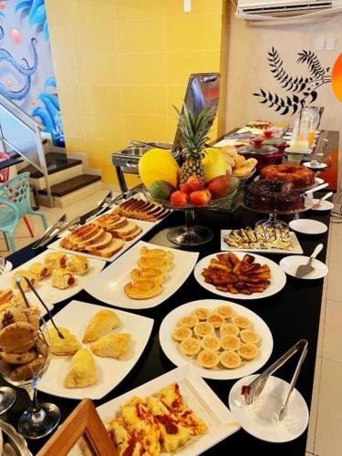 a buffet with many different types of food on a table at Mural Living Hotel Manaus in Manaus