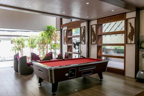 a billiard room with a pool table in it at A Sleep Bangkok Sathorn in Bangkok