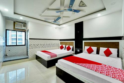 Un pat sau paturi într-o cameră la Flagship Dn Daya Vatika