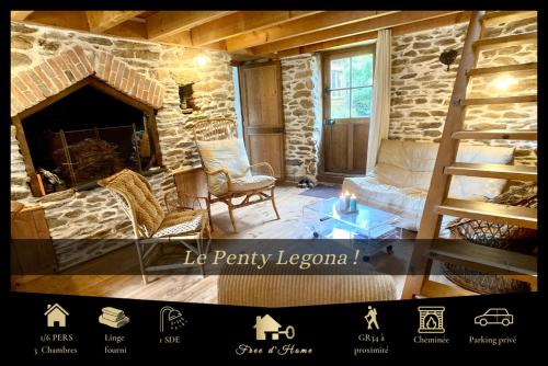 a living room with a stone fireplace and a ladder at Penty LEGONA, authentique et chaleureux, 2-6 pers in Moëlan-sur-Mer