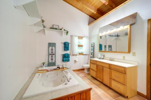 a bathroom with a tub and a sink and a toilet at Butler Retreat on 60 Acres Near Beech Mountain! in Beech Mountain