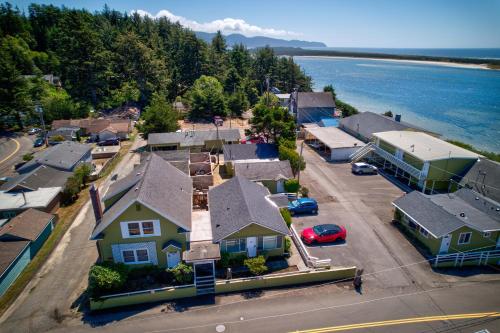 an aerial view of a town with houses and the water at Terimore Lodging by the Sea in Tillamook