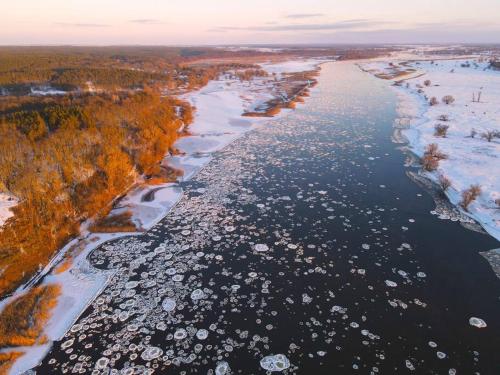 an aerial view of a river with lots of boats at OderPoint#Sauna#Jacuzzi in Gozdowice