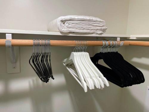 a rack with a bunch of forks and towels at Bright Top Floor-Elevator-Walk Downtown-Laundry in Walnut Creek