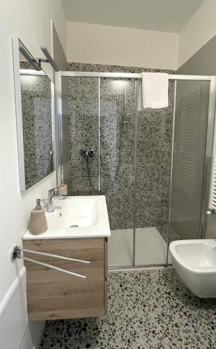 a bathroom with a sink and a shower at Santa Vincenza - Suite Indipendente in Lovere