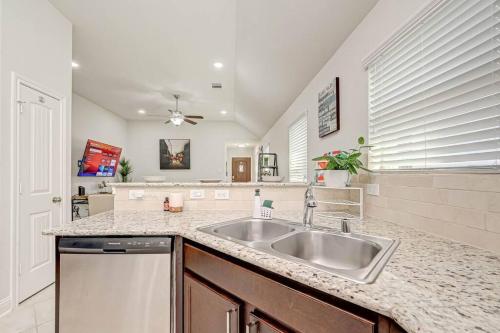 a kitchen with a sink and a counter top at IAH-Houston Hideaway - Free Parking, WiFi, Sleeps 10 in Humble
