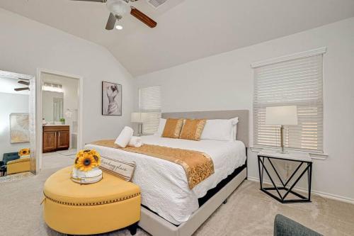 a bedroom with a bed and a table with a dog on it at IAH-Houston Hideaway - Free Parking, WiFi, Sleeps 10 in Humble