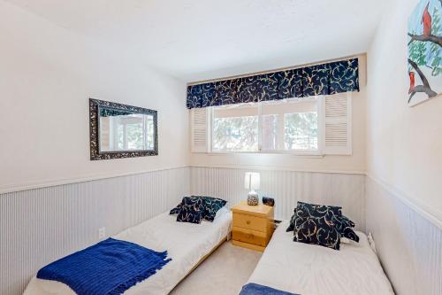 a bedroom with two beds and a window at Mountain Shadows in Incline Village