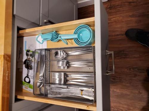a drawer filled with utensils in a refrigerator at The Lazy Lynx - Frontier Village in North Pole