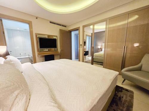 Postel nebo postele na pokoji v ubytování Luxury Paramount Hotel Apt D111