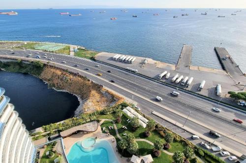 an aerial view of a highway and a bridge over the water at Ottomare Apartments in Istanbul