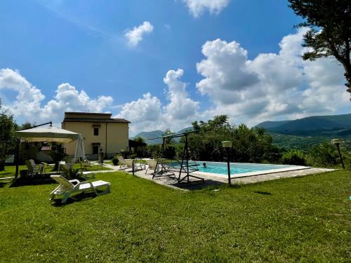 a villa with a swimming pool and a house at Villa con Piscina Donna Romina in SantʼAgata deʼ Goti
