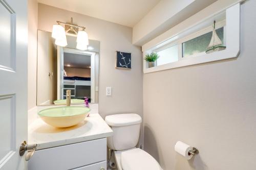 a bathroom with a bowl sink and a toilet at Coastal PNW Home on Swimmable Beach with Hot Tub! in Stanwood