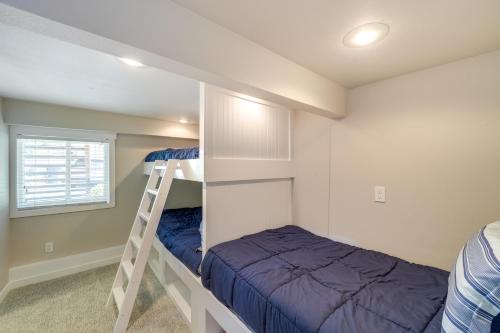 a bedroom with two bunk beds and a ladder at Coastal PNW Home on Swimmable Beach with Hot Tub! in Stanwood