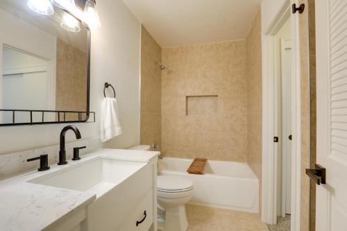 a bathroom with a sink and a tub and a toilet at Modern Sacramento Townhome with Patio! in Sacramento