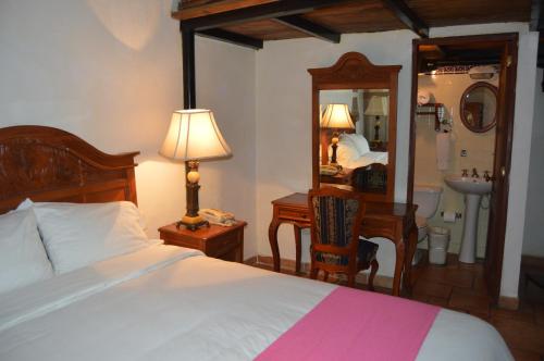 Postel nebo postele na pokoji v ubytování Hotel Meson del Mar