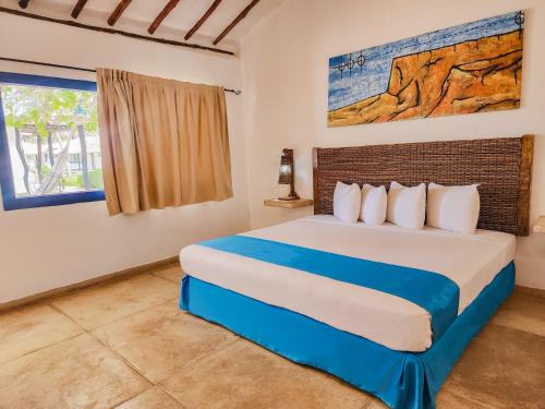 a bedroom with a large bed in a room at Sunsol Punta Blanca in San Pedro de Coche