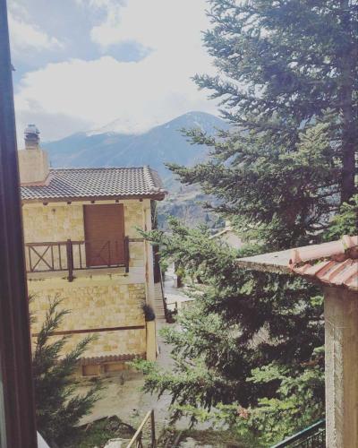 a view from a window of a house with a tree at Evergreen Suites in Synikia Mesi Trikalon